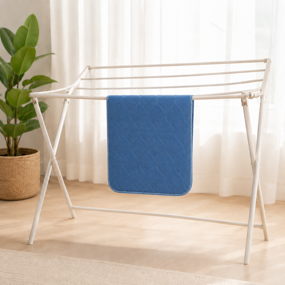 Washable care pad drying completely in a bright home laundry area